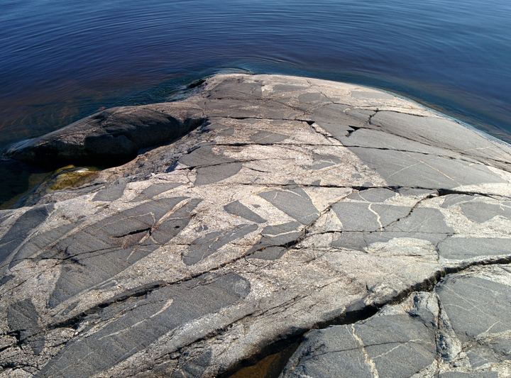 Patterned granite meeting the water